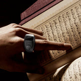 Black Smart Zikr Ring Flex Pro used during Quran recitation, designed for seamless zikr and prayer support.