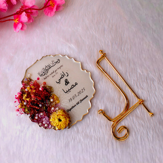 Customizable Floral Round Couple Frame in resin art with gold stand, featuring preserved flowers and romantic text, perfect for home decor or gifts.