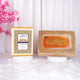 Golden glittered Quran box with Arabic calligraphy and pink flowers