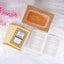 Golden glittered Quran box with Arabic calligraphy and pink flowers