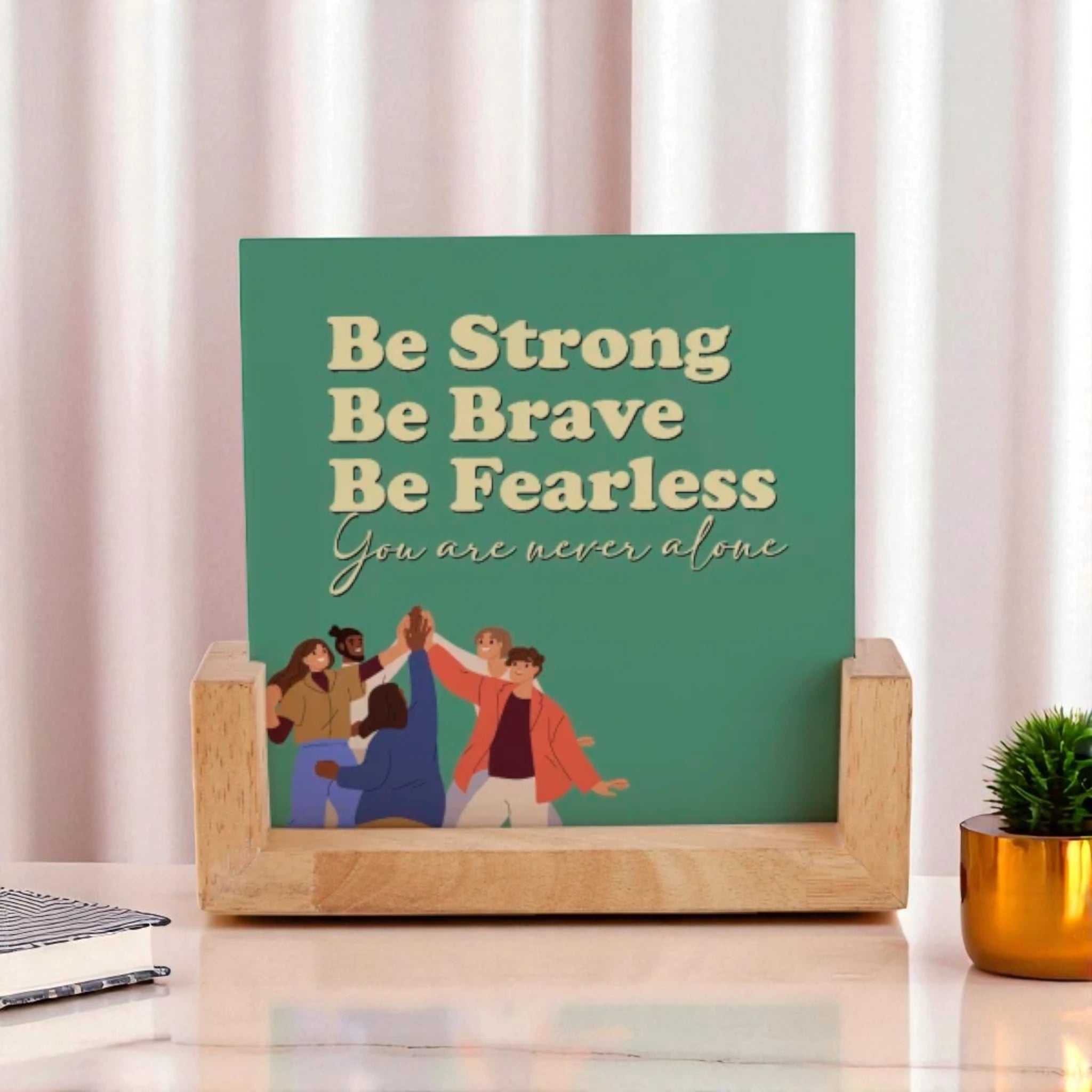 Double-sided frame with motivational quote 'Be Strong, Be Brave, Be Fearless' on green background, set in a wooden base for desk display. Main image