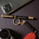 Custom engraved black and gold Personalised Pen and Key Chain set beside a smartphone and watch, perfect for executive gifts.