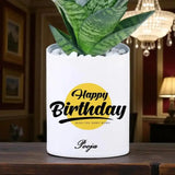 Custom ceramic pot with Personalized Birthday Snake Plant and name inscription, stylish green gift for indoor spaces and celebrations.
