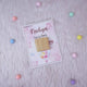 Single Aqiqah Sweet Blessings Favor with gold chocolate on a pink card with balloons and stars, designed for personalized Aqiqah gifts.