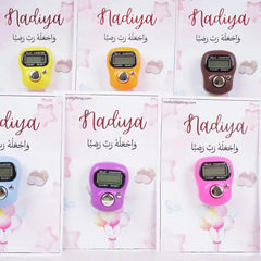 Close-up of Nadiya-themed Tasbeeh Favors in pink, purple, and yellow, elegant Islamic gifts for Aqiqah or wedding ceremonies.