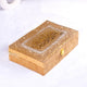 Gold decorative box with intricate designs on a white background