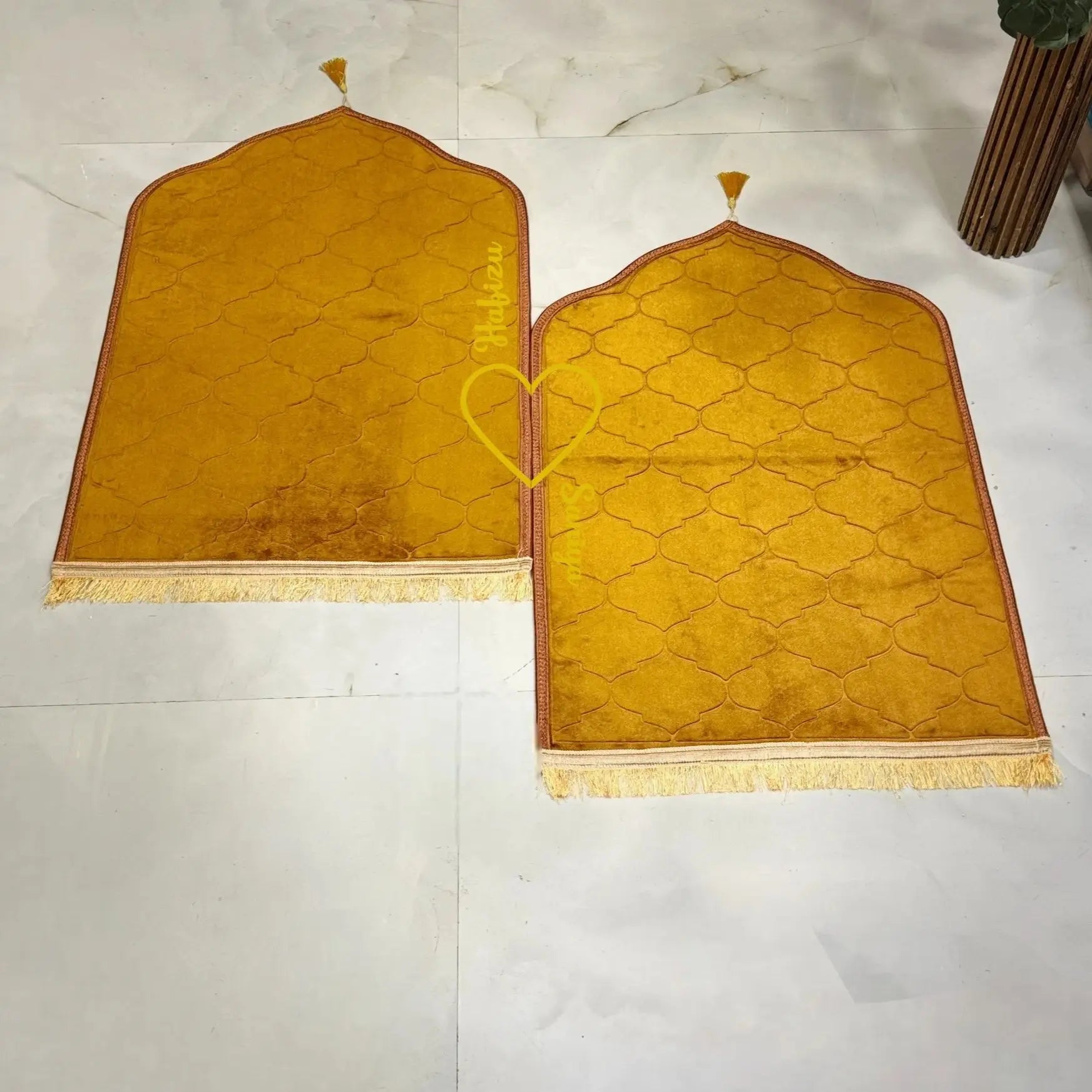 Golden velvet prayer mats with arched design and tassels, part of the Golden Floral Pearl Bridal Sawab-e-Jariya Hamper wedding gift set. Main image