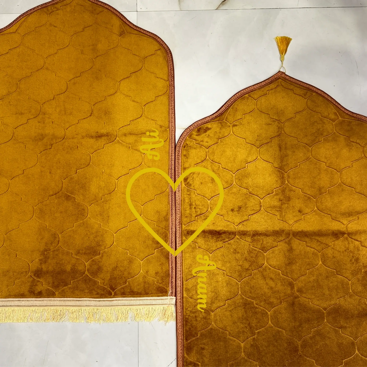 Close-up of Golden Dome Family Janamaz Set showing personalized names 'Ali' and 'Aiman' with heart design, ideal for wedding gifting.