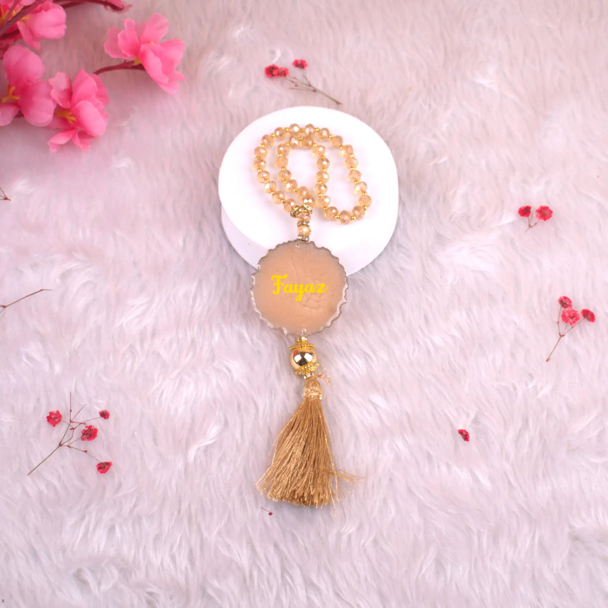 Golden Tasbeeh Beads with Resin Agate and name 'Fayaz', 33 handmade beads ideal for gifting during Islamic celebrations.