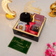 Golden Ramadan Mubarak Hamper - Ramadan Gift Hamper with black hijab, sweets, Islamic book, and greeting card for festive gifting.