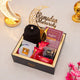 Luxury Golden Ramadan Mubarak Hamper featuring black hijab, Fortress of the Muslim book, gourmet treats, and Ramadan decor.