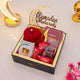 Golden Ramadan Mubarak Hamper - Ramadan Gift Hamper with red hijab, prayer book, gourmet snacks, and festive crescent moon decor.
