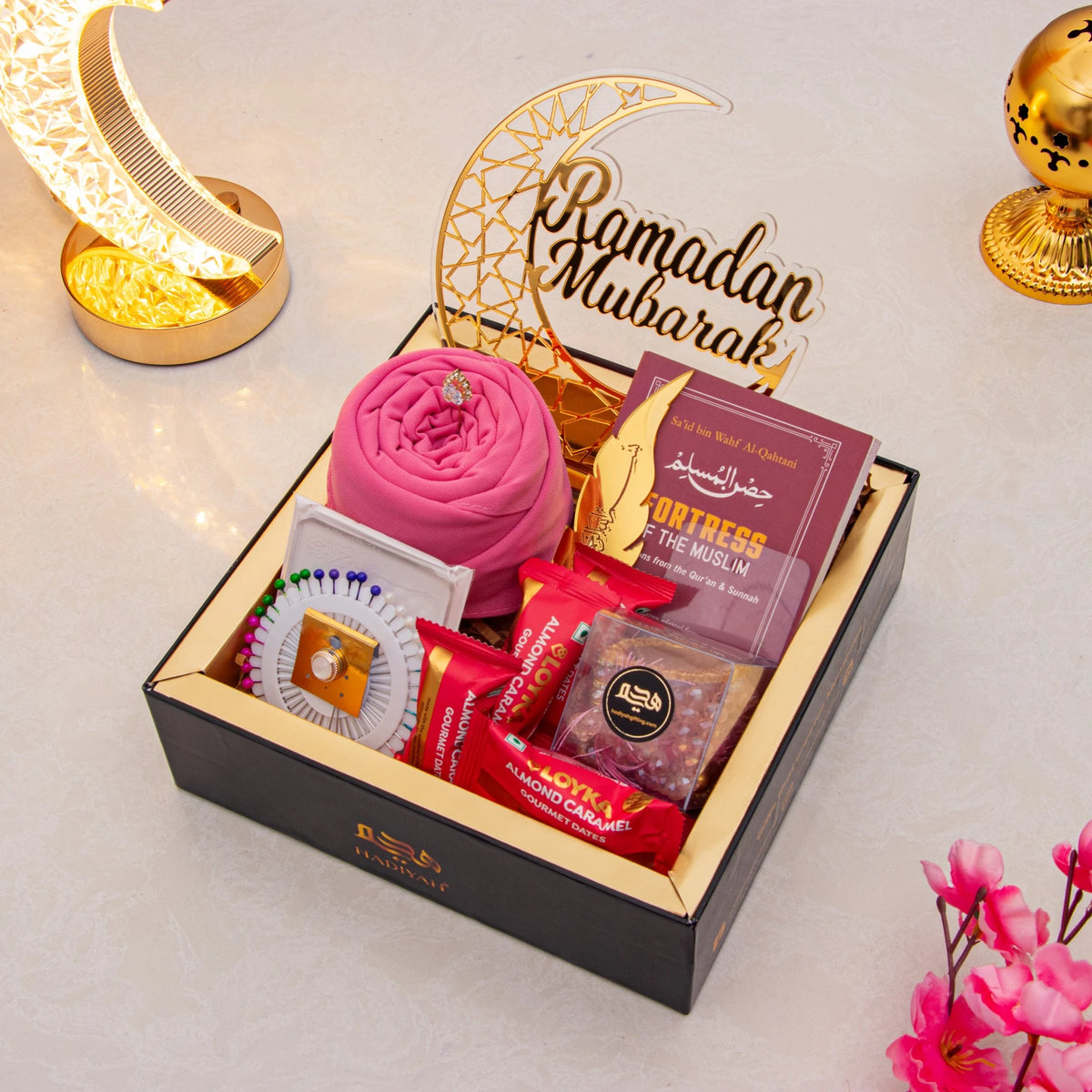 Golden Ramadan Mubarak Hamper - Ramadan Gift Hamper featuring dates, prayer essentials, Islamic book, and gourmet treats in a luxury black box.