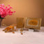 Premium Golden Sequence Rehal Hamper featuring Quran, glitter Rehal, and tasbeeh, displayed elegantly with floral decor. Perfect for gifting occasions.