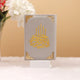 Velvet-covered grey Quran with golden Arabic calligraphy, part of the bridal Quran gift set. A luxurious and spiritual wedding gift.