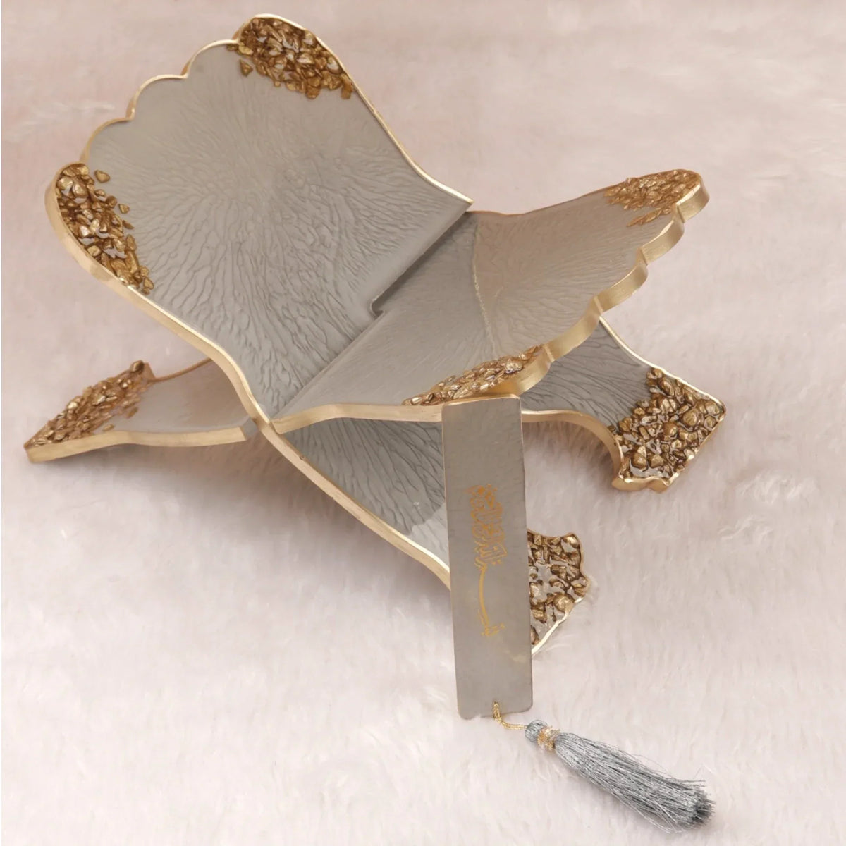 Decorative grey and gold rehal stand from the Grey Stones Quran Gift Set. Perfect for displaying the Quran during recitation.