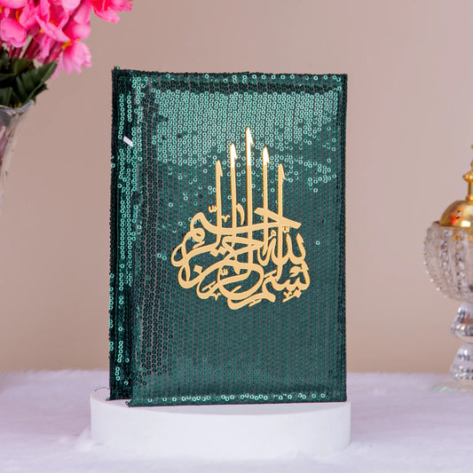 Green sequin-covered Quran with golden Arabic calligraphy, part of the Bridal Hamper - The Bling Collection for elegant Islamic wedding gifts.