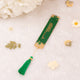 Elegant green and gold Islamic bookmark with tassel from the Green Flakes Sawab-E-Jariya Hamper, ideal for Quran reading.
