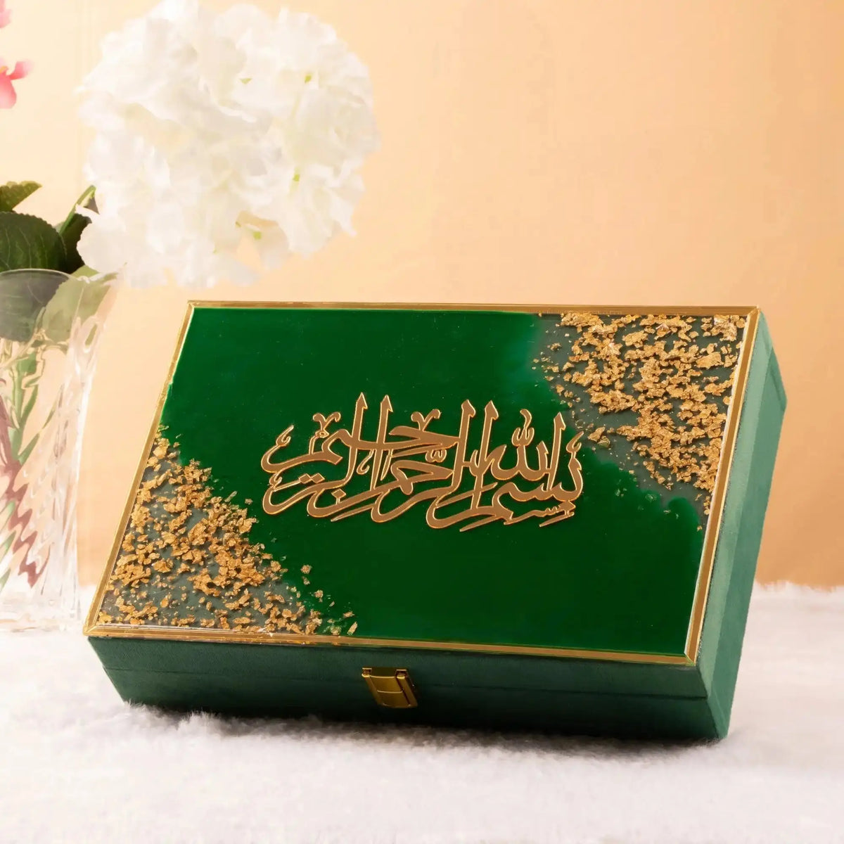 Green and gold decorative gift box with Islamic calligraphy from the Green Flakes Sawab-E-Jariya Hamper, ideal for Quran storage.