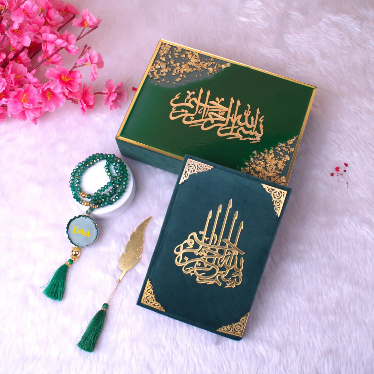 Tilawat Quran Gift Set featuring green velvet Quran, personalized Tasbeeh, and gold feather bookmark in a luxury green and gold box.