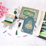 Decorative items with Arabic calligraphy on a white surface with pink flowers.
