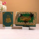 Two decorative boxes with Arabic calligraphy on a neutral background