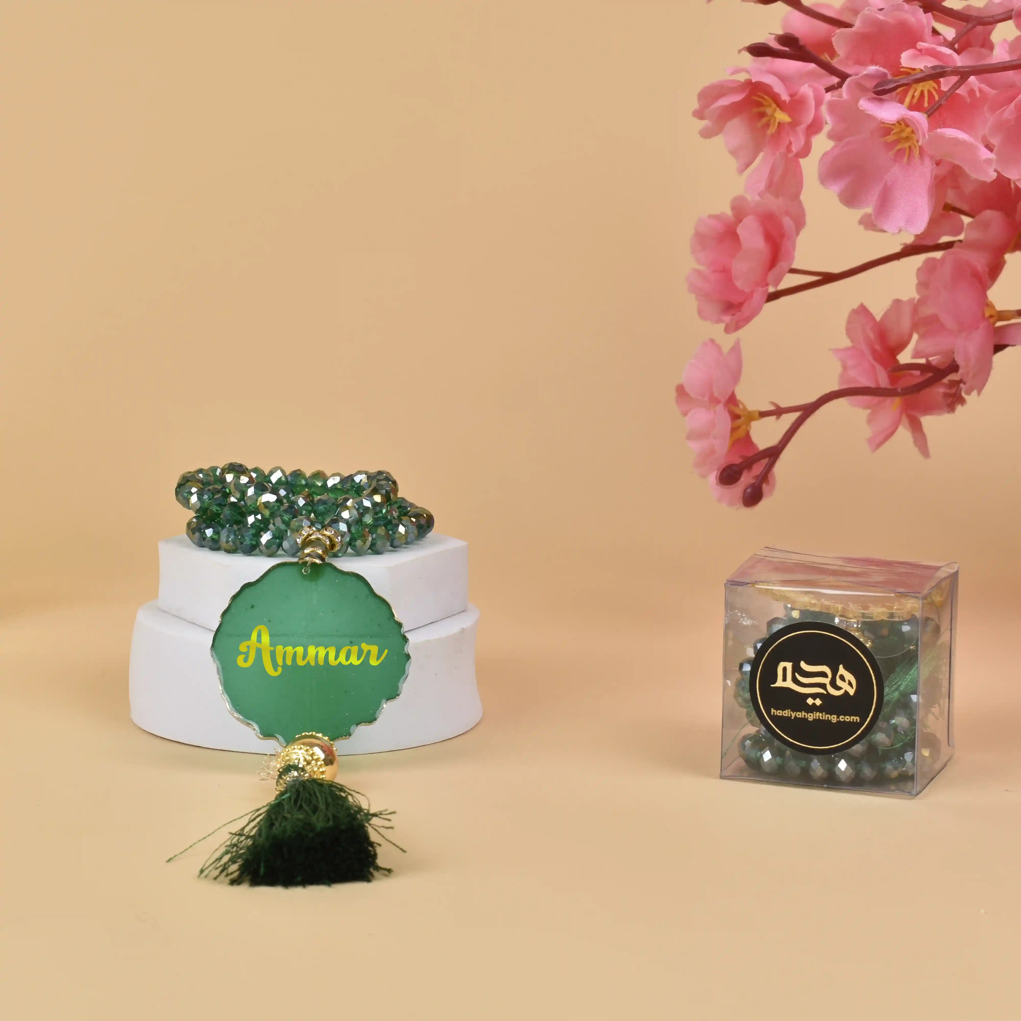 Green Crystal Tasbeeh 100 Beads - Personalized Gift with name 'Ammar', displayed in elegant packaging, ideal for Islamic gifting and Hajj & Umrah. Main image
