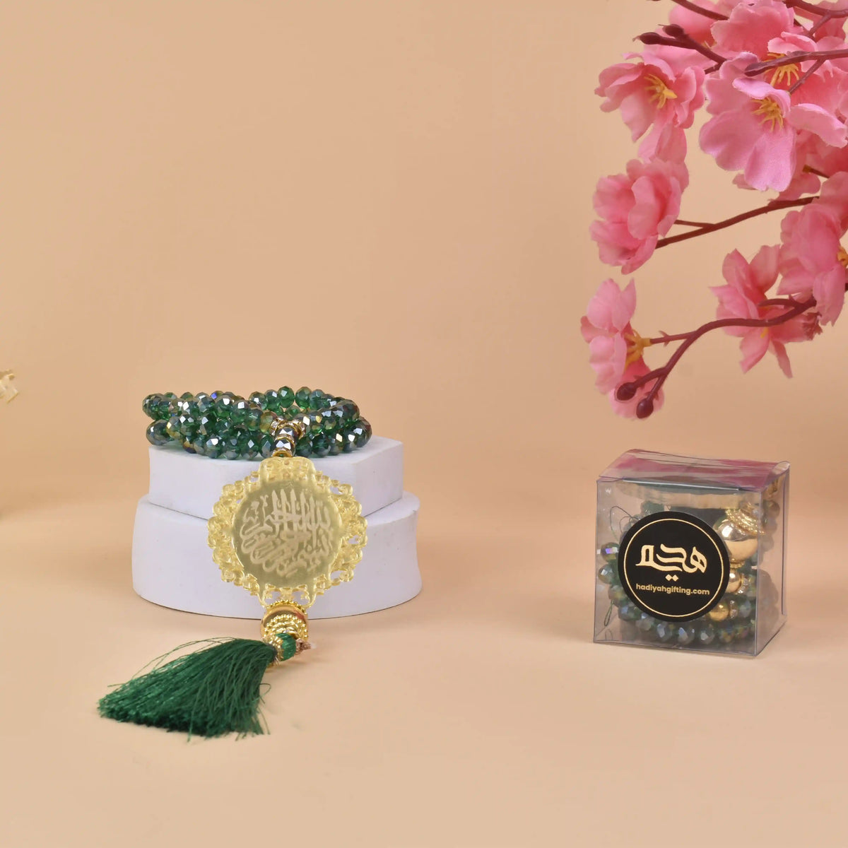 Green Crystal Tasbeeh - 100 Beads with gold Bismillah charm and green tassel, ideal Islamic gift for Ramadan, Eid, or weddings.