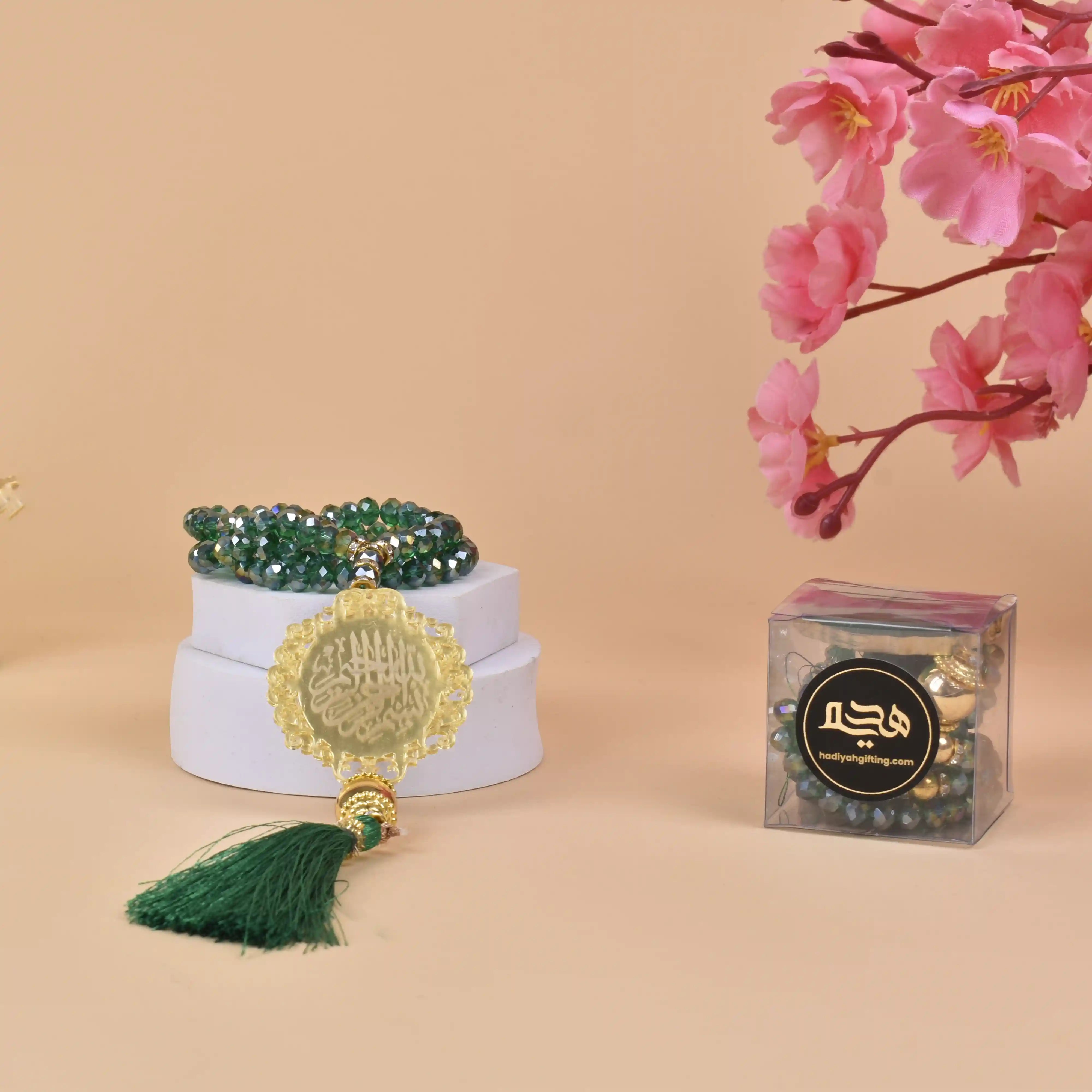 Green Crystal Tasbeeh - 100 Beads with gold Bismillah charm and green tassel, ideal Islamic gift for Ramadan, Eid, or weddings. Main image