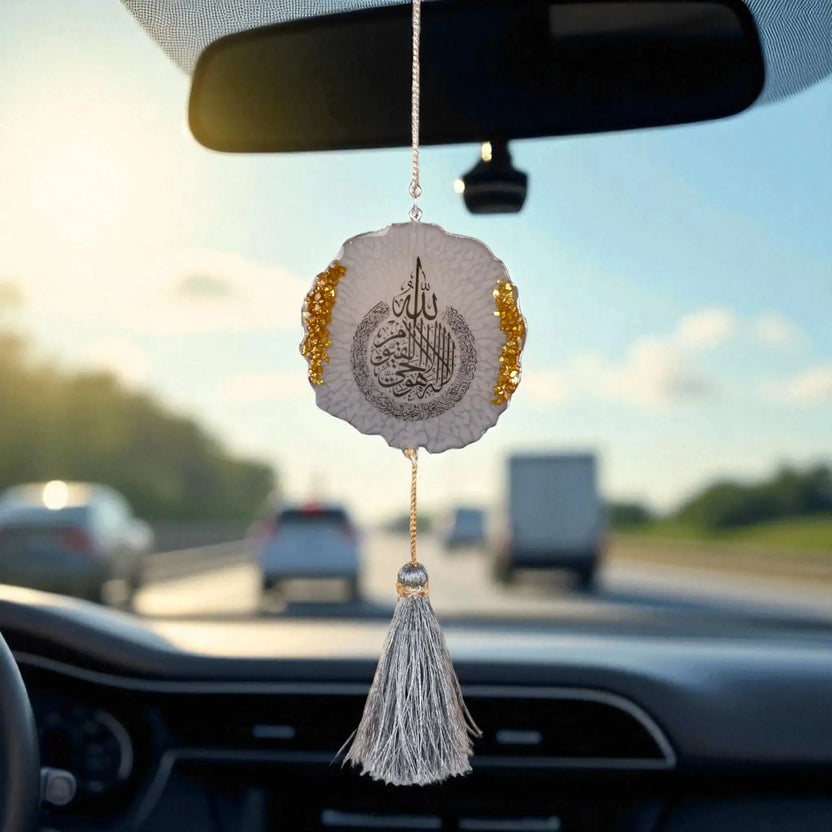 Grey Flakes Designer Car Hanging - 3 inches with shimmering flake pattern and tassel, hanging from rear view mirror on a highway drive. Main image