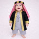 Baby boy wearing traditional black and gold embroidered thobe with red and white checkered headscarf