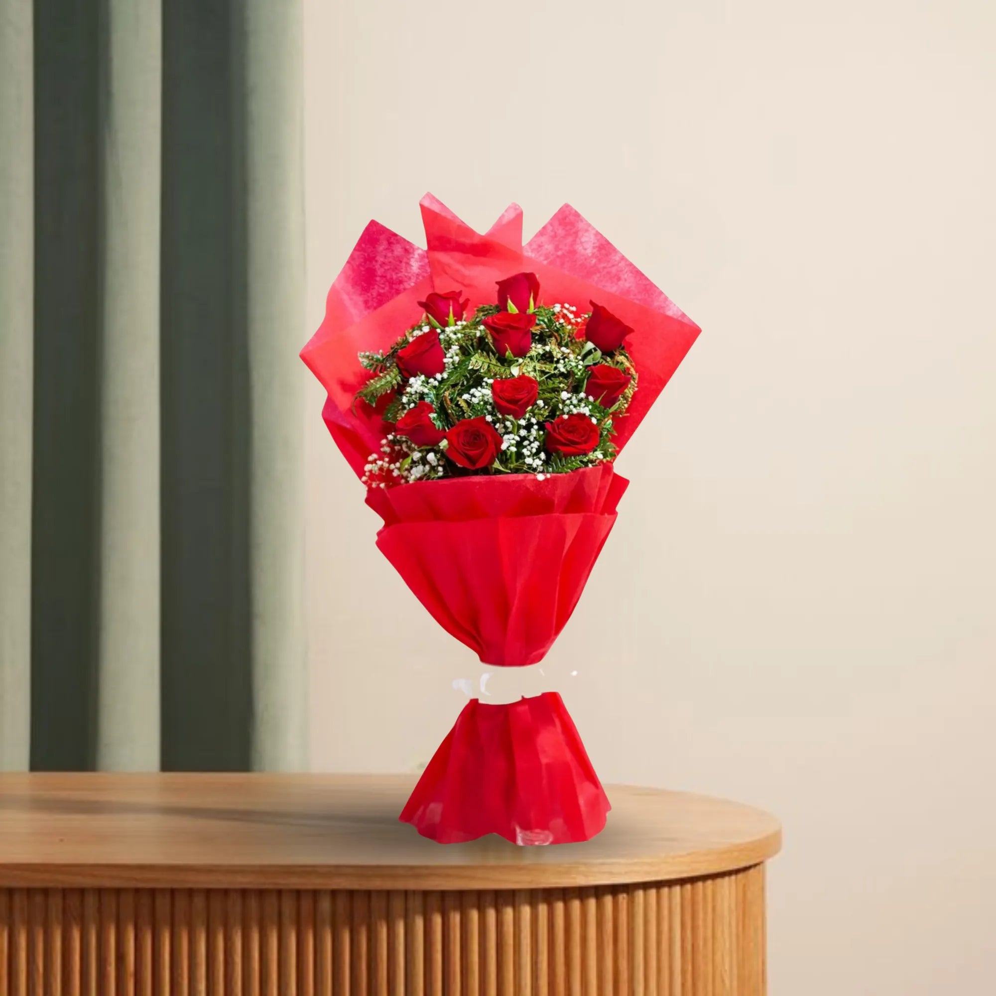 Blooming Insight - Bright Bloom Bouquet with 10 red roses and white fillers, wrapped in elegant red 2-layer fabric, displayed on a wooden table. Main image