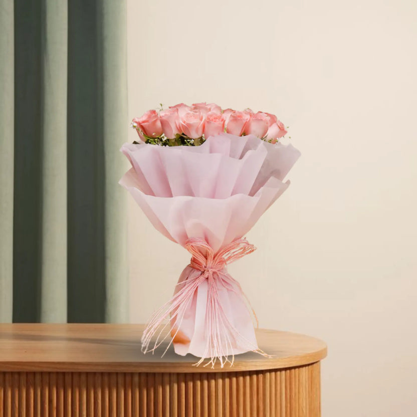 Love Confessing Delights - Romantic Roses Bouquet featuring 20 pink roses with green fillers, wrapped in soft pink fabric, ideal for anniversaries. Main image