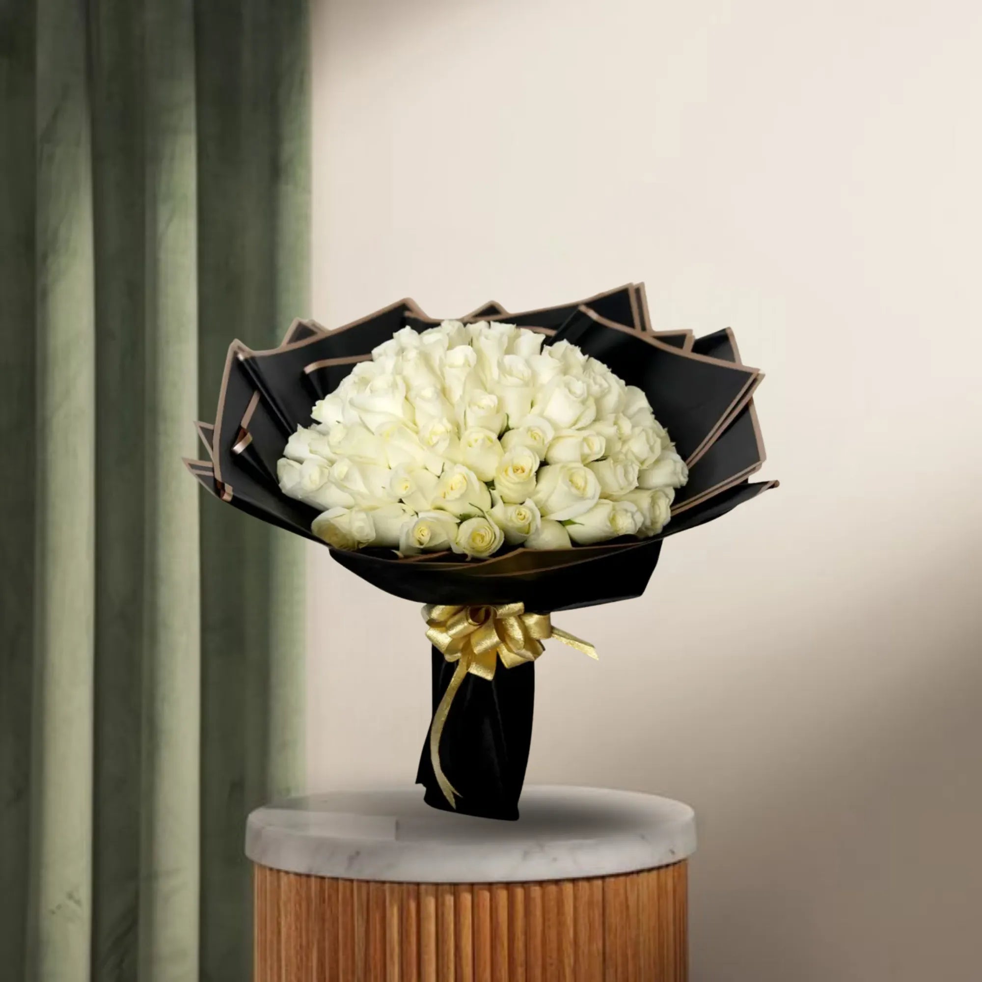 Peaceful White Roses Bouquet - White Roses | 100 Stems arranged with green fillers in black paper wrapping, ideal for condolences or celebrations. Main image
