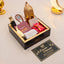Gift box with Ramadan-themed items on a light background