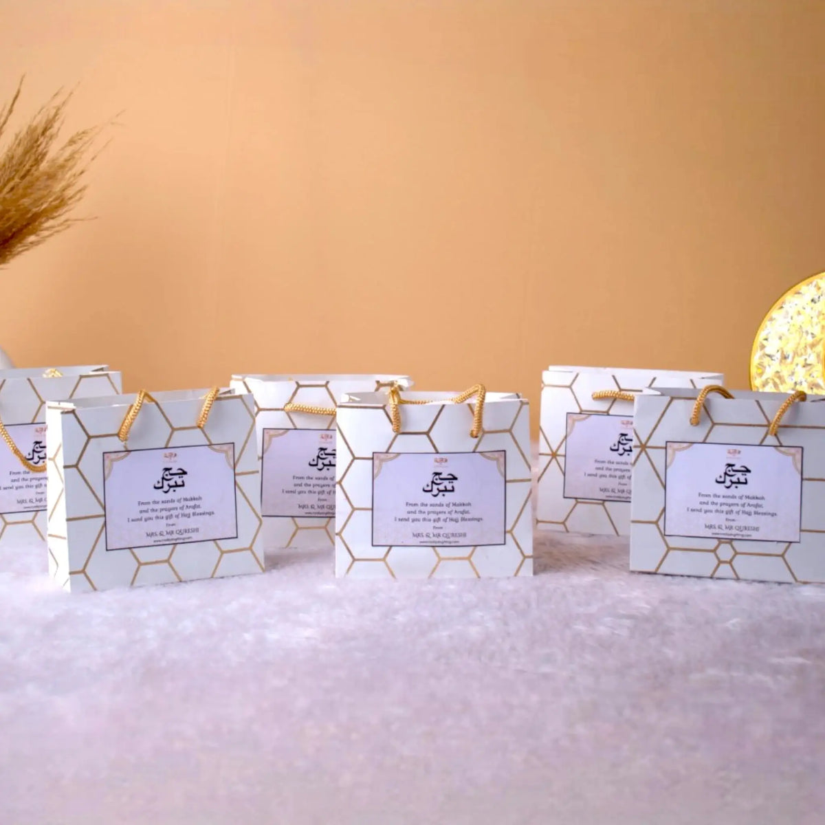 Set of 5 Barakah Hajj Gift Hampers with decorative packaging. Perfect for Hajj return gifts and Islamic ceremonial favors.