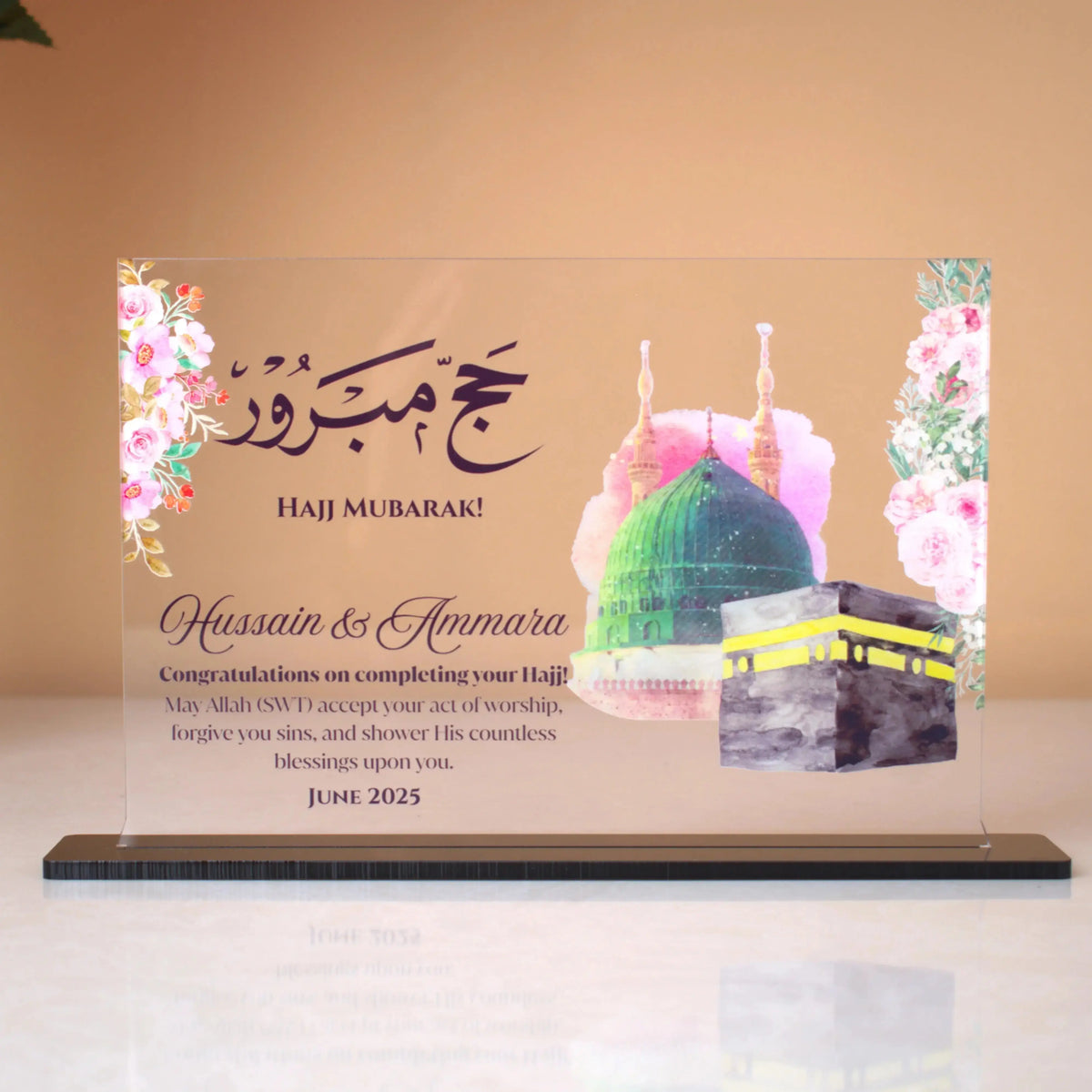 Horizontal personalized Hajj Umrah Acrylic Plaque with Kaaba design, floral details, and congratulatory message for pilgrims.