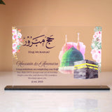 Horizontal personalized Hajj Umrah Acrylic Plaque with Kaaba design, floral details, and congratulatory message for pilgrims.