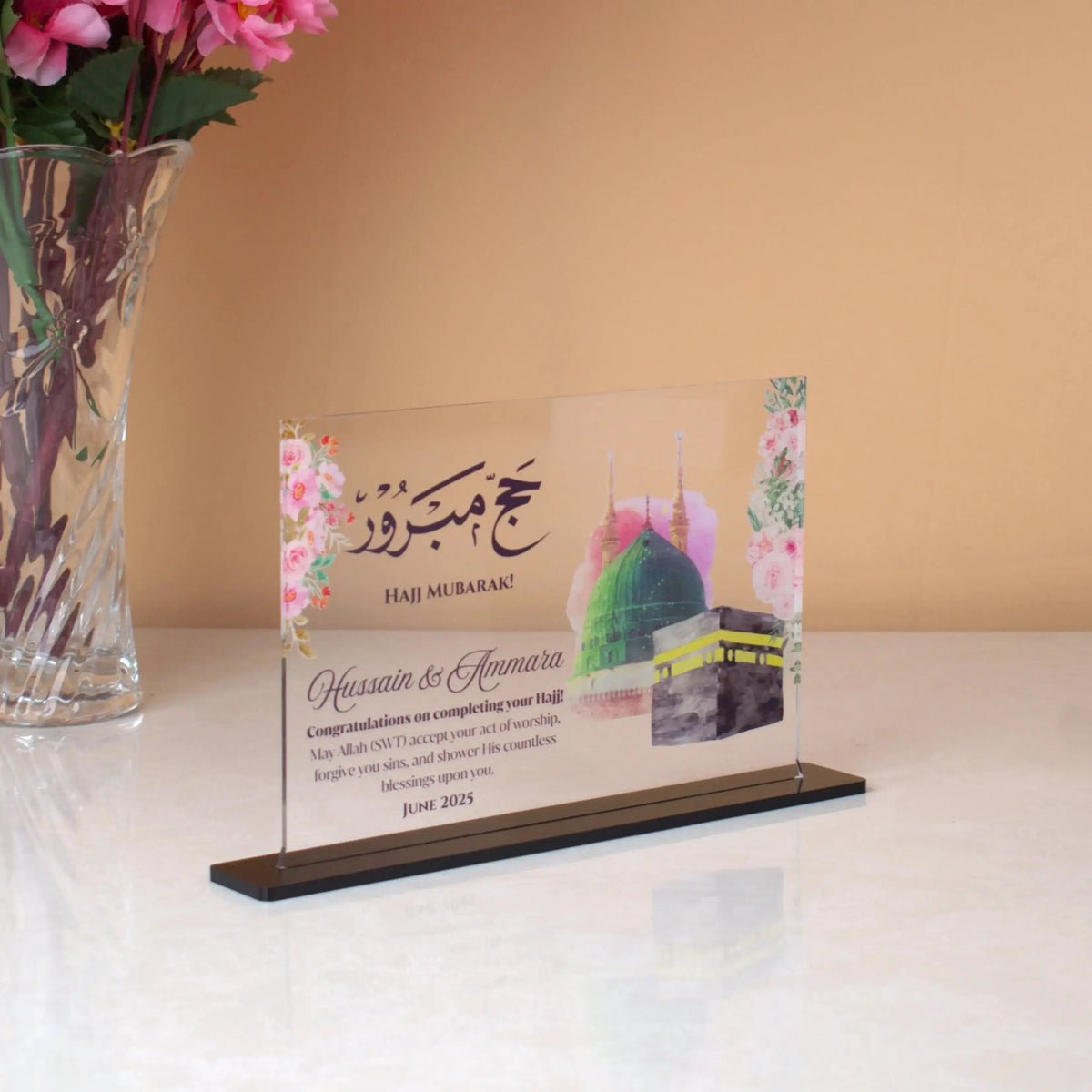 Elegant Kaaba Design Acrylic Plaque for Hajj & Umrah gifts, featuring custom names, floral accents, and spiritual blessings.