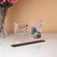 Elegant Kaaba Design Acrylic Plaque for Hajj & Umrah gifts, featuring custom names, floral accents, and spiritual blessings.