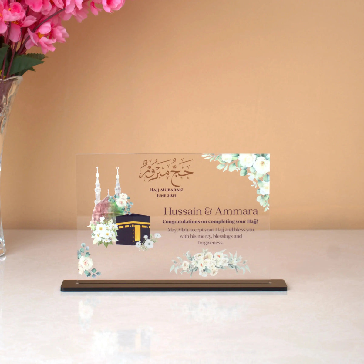 Labbaik-e-Haram Gifting Plaque featuring Kaaba Sharif and floral design, ideal for Hajj or Umrah return gifts or keepsakes. Personalized with names and date.