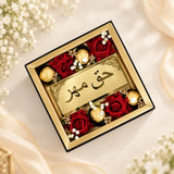 Haqq Meher Envelope with Chocolates Hamper – clear acrylic Meher envelope with red roses and chocolates, elegant bridal gift for Islamic Nikah ceremony