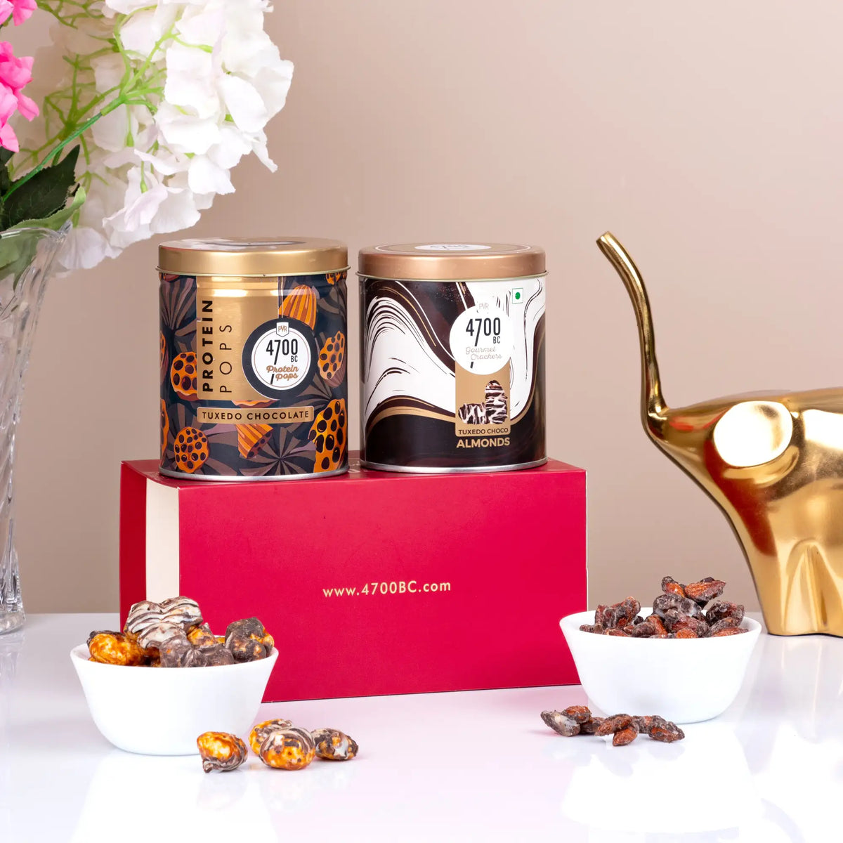 4700BC Tuxedo Chocolate Duo featuring dark chocolate and almond popcorn jars, displayed with gourmet popcorn in bowls, perfect gift hamper.