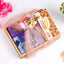 Gift set with cookies, flowers, and a decorative box on a white background
