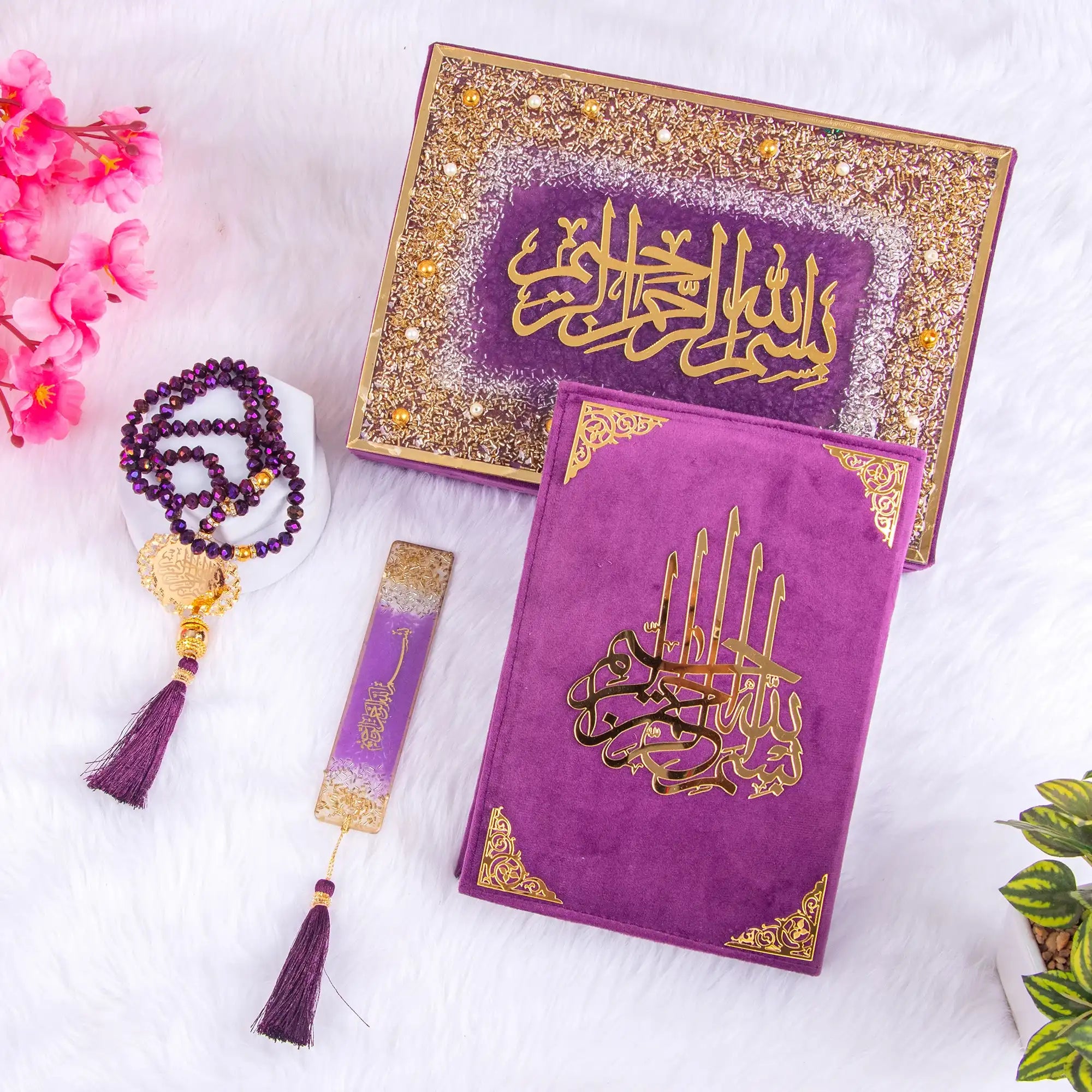 Purple religious text books with gold calligraphy, prayer mat, and tasbih on a white background. Main image