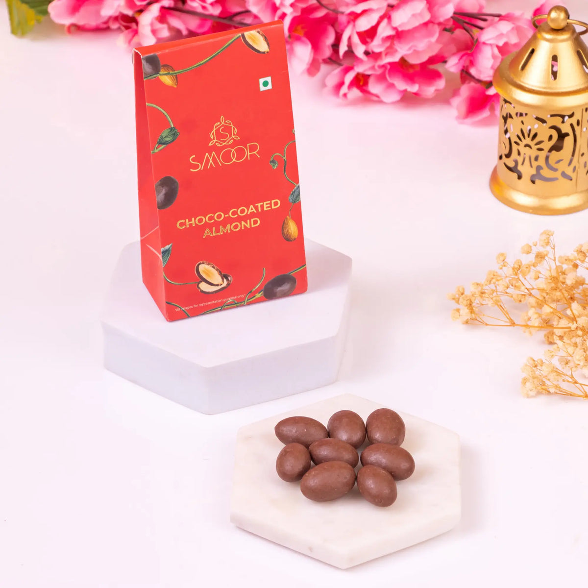 Close-up of Smoor Choco-Coated Almonds from Khushi Aur Mithaas Ka Tohfa hamper. Premium sweet treat for festive and gourmet gift baskets.
