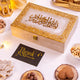 Elegant Noor Al-Lazeez Sweet Collection gift box with golden Arabic calligraphy, perfect for festive gifting with sweets and dry fruits.