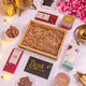 Empty wooden gift box with shredded filler from the Heavenly Indulgence Treat Hamper, ready for Ramadan and Eid packaging.
