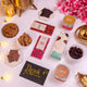 Unboxed Heavenly Indulgence Treat Hamper showing assorted sweets, cookies, and chocolates for Eid and Ramadan gifting.