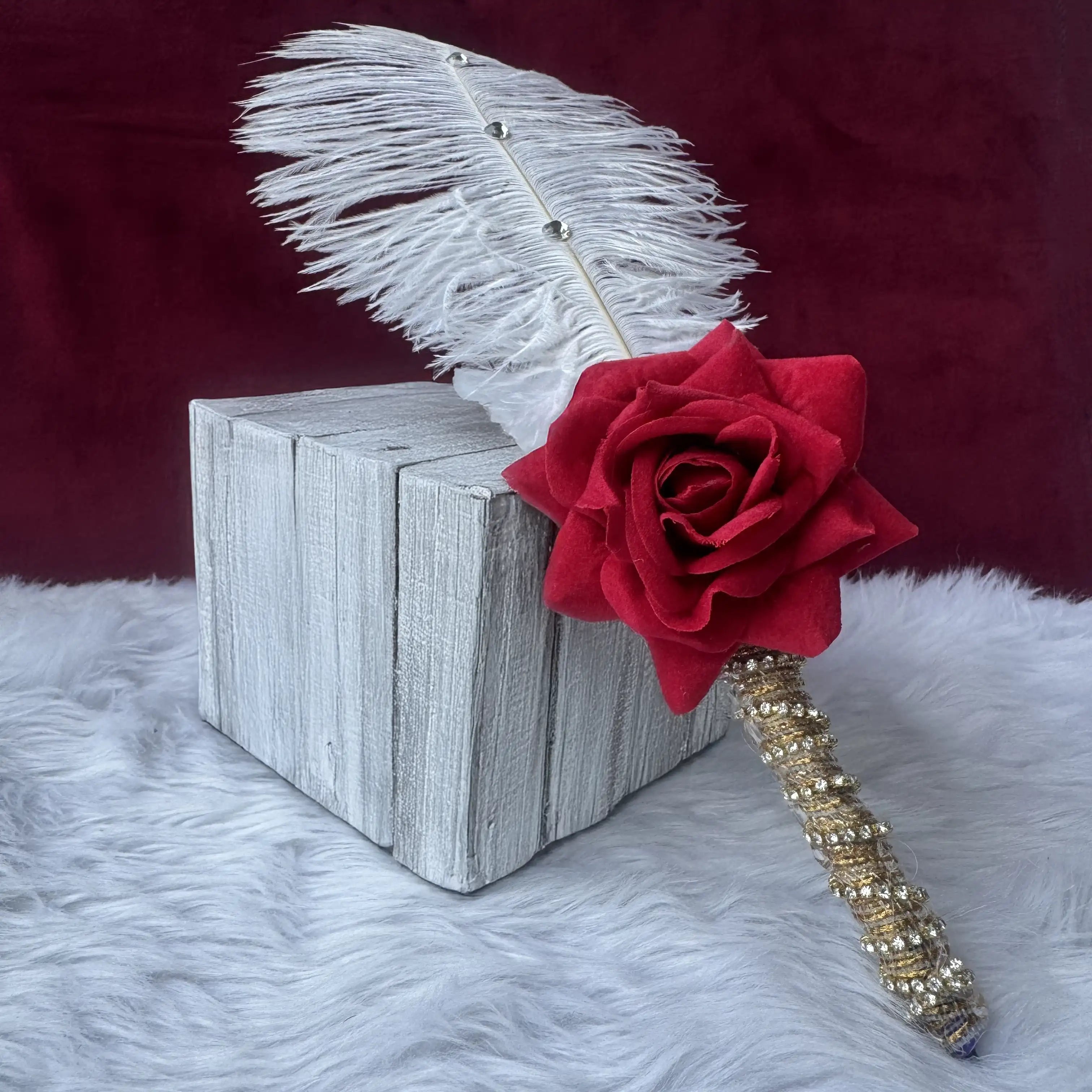 Decorative feather pen with red rose and gold embellishments from Amaanat-e-Nikaah Sawab-e-Jariya Nikah gift set. Main image